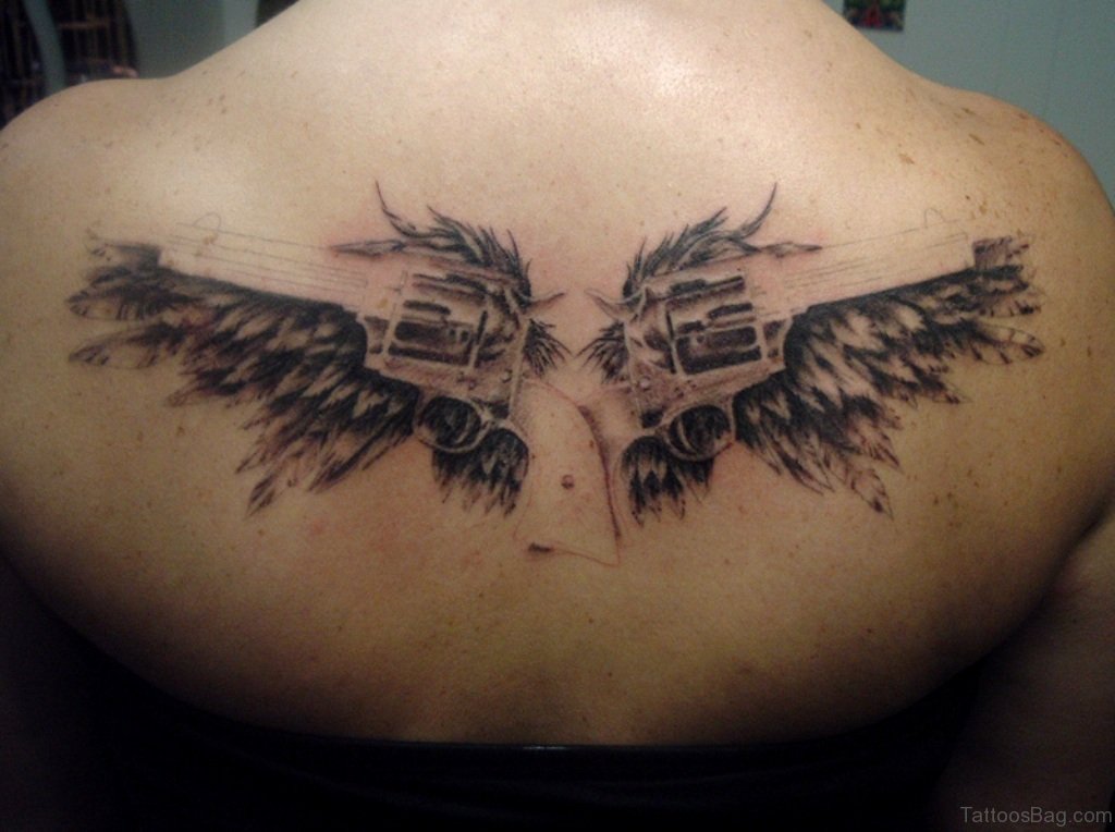 Angel Wings With Guns Tattoo.