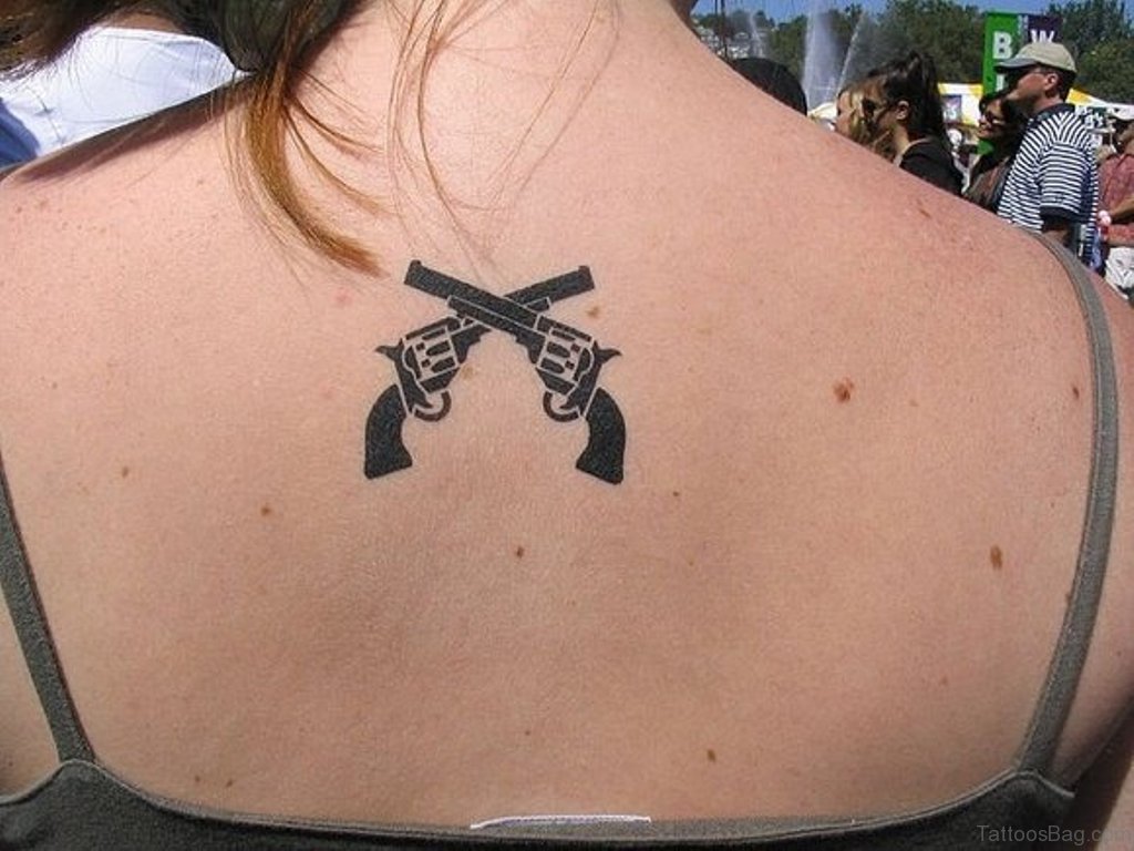 Two Crossing Gun Tattoo.