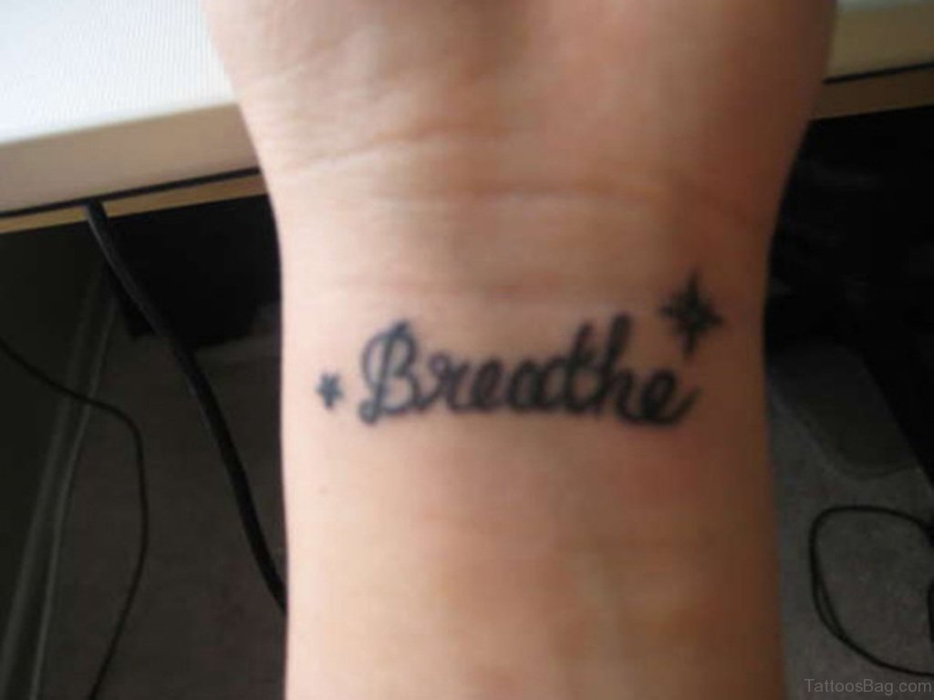 Black Word Breathe Tattoo.