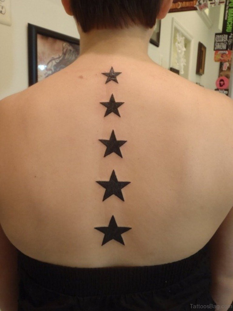 star tattoos on back of women