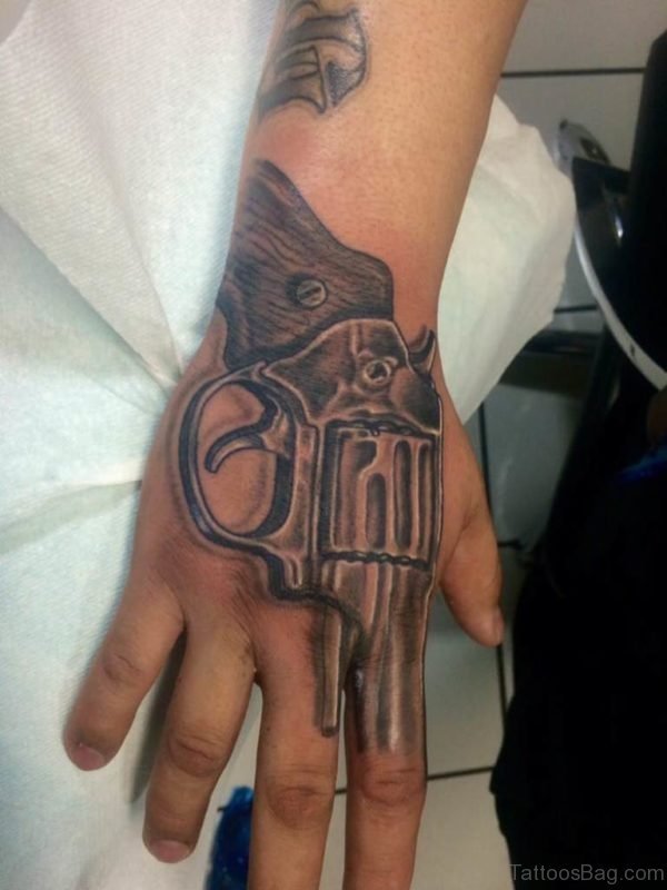 28 Funky Gun Tattoos On Hand - Tattoo Designs – TattoosBag.com