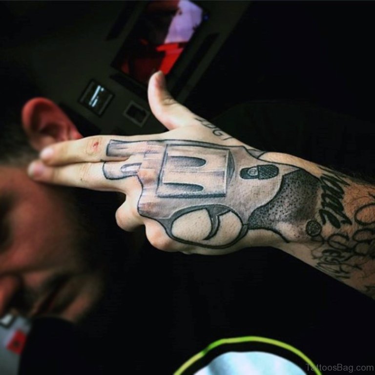 28 Funky Gun Tattoos On Hand