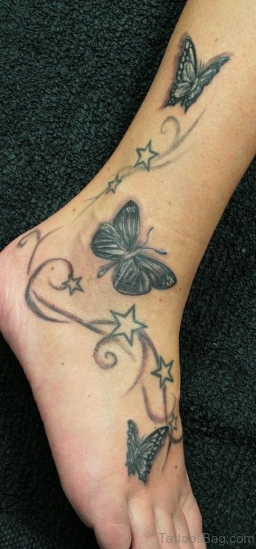 Butterfly and star leg tattoos